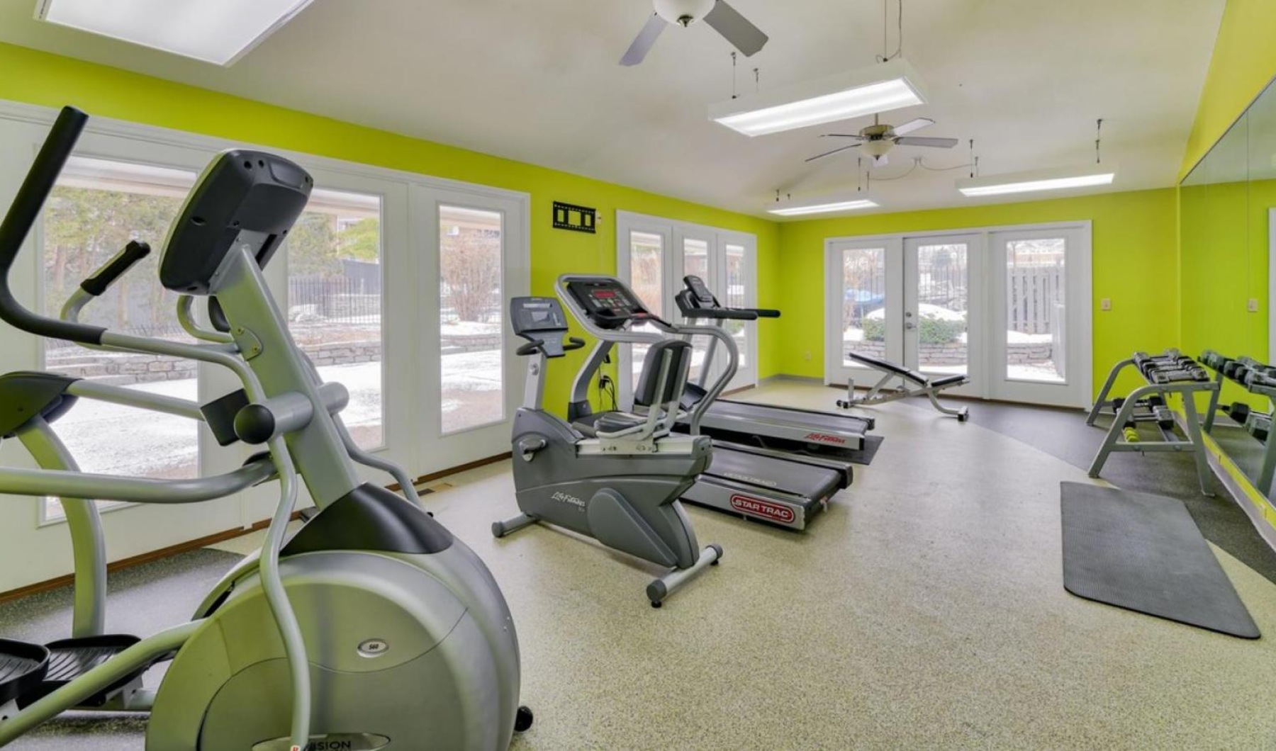 Workout in style in our 24-hour fitness center a gym with exercise equipment